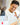 Person wearing a white shirt with ANGKAN logo in a kitchen setting